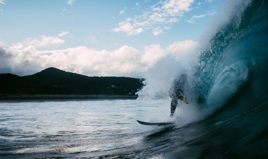 surfer hit by wave